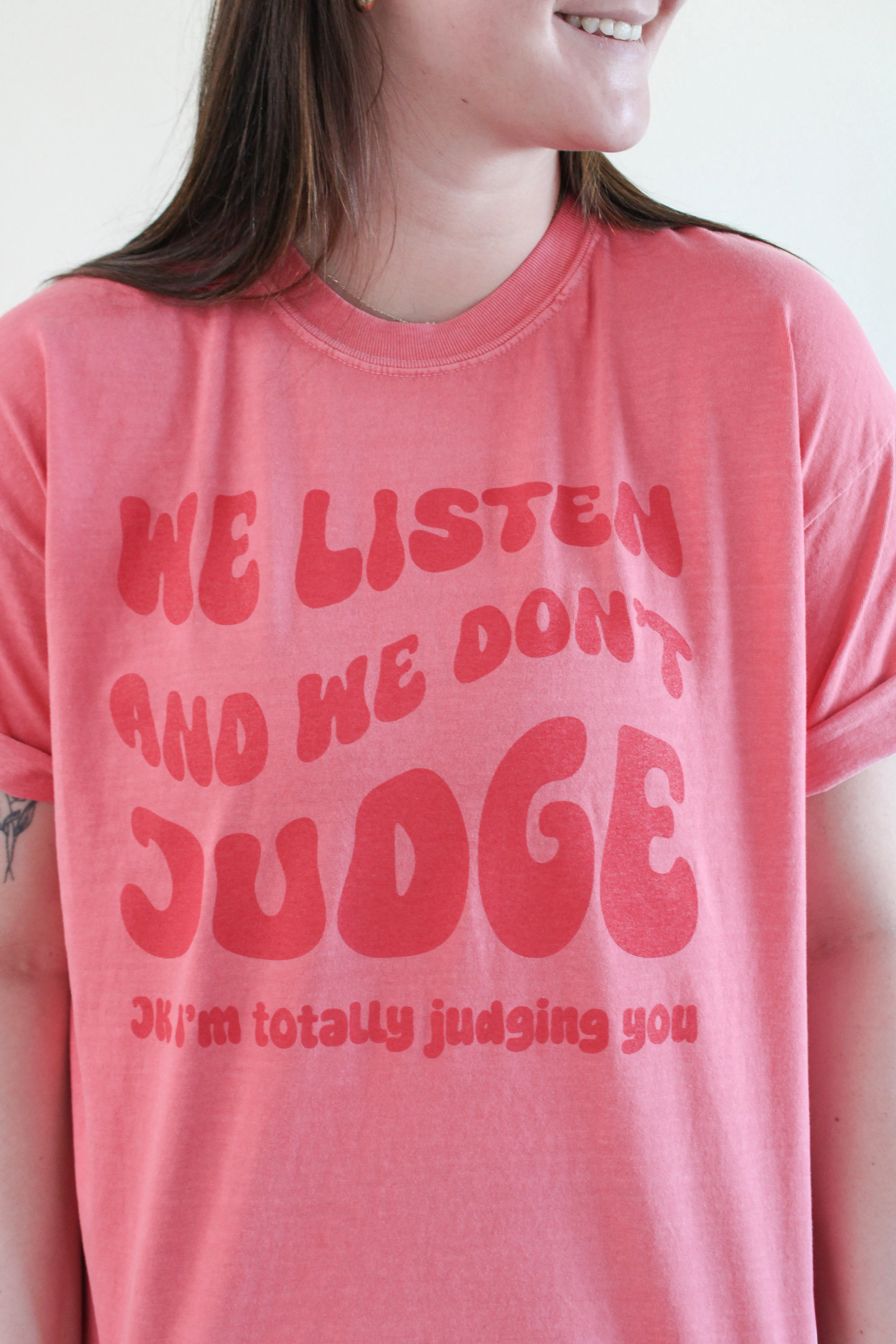 WE LISTEN AND WE DON'T JUDGE GRAPHIC TEE