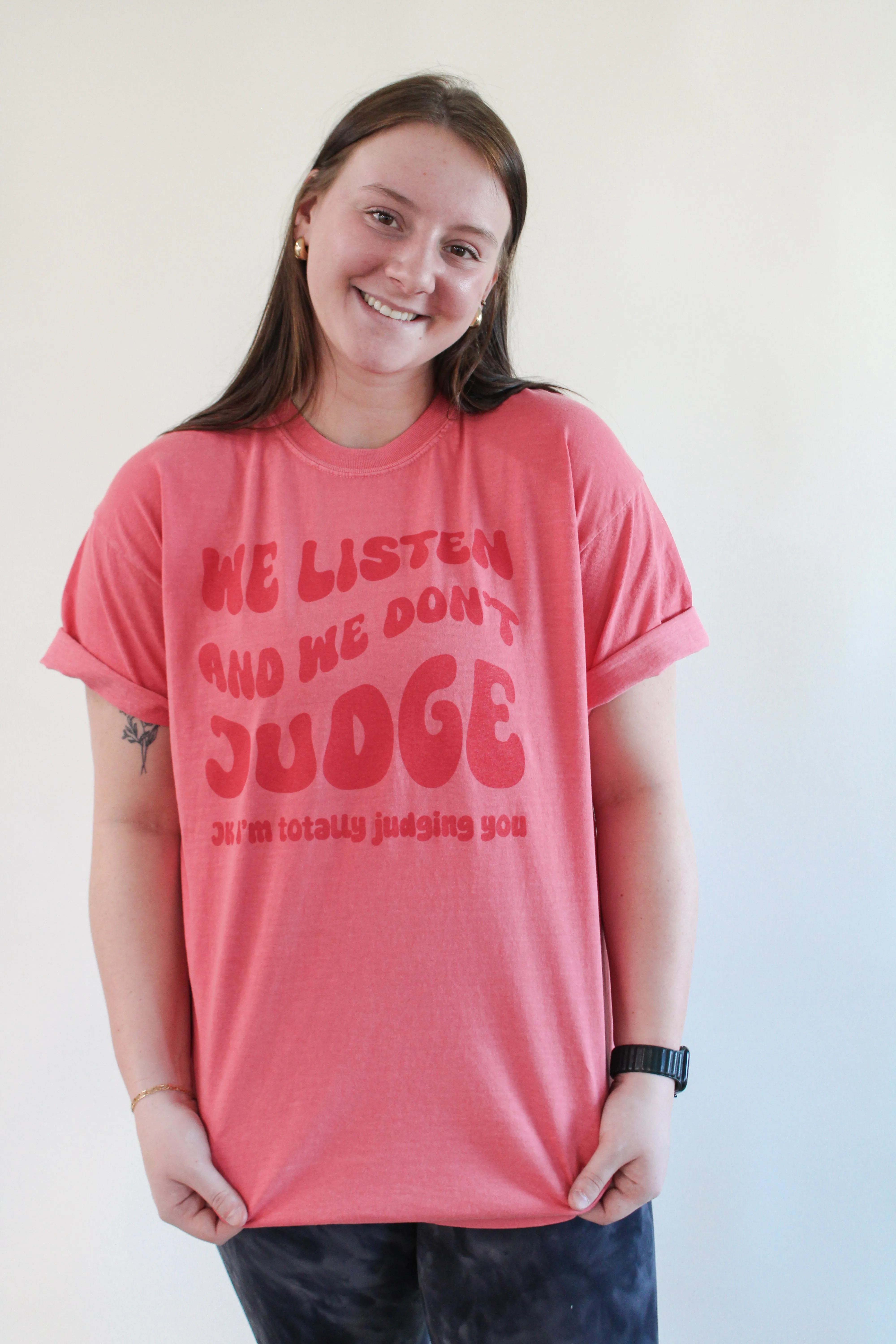 WE LISTEN AND WE DON'T JUDGE GRAPHIC TEE